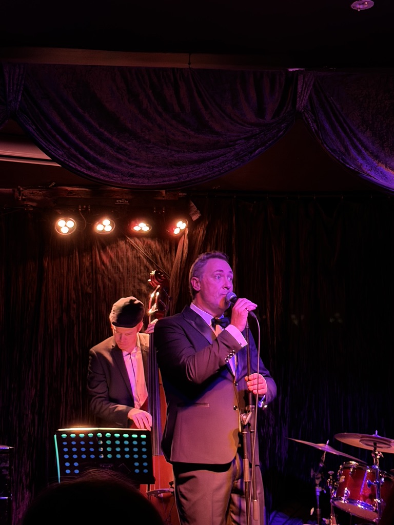 Wade Morgan performing at Paris Cat Jazz Club, Melbourne, with double bass and jazz ensemble