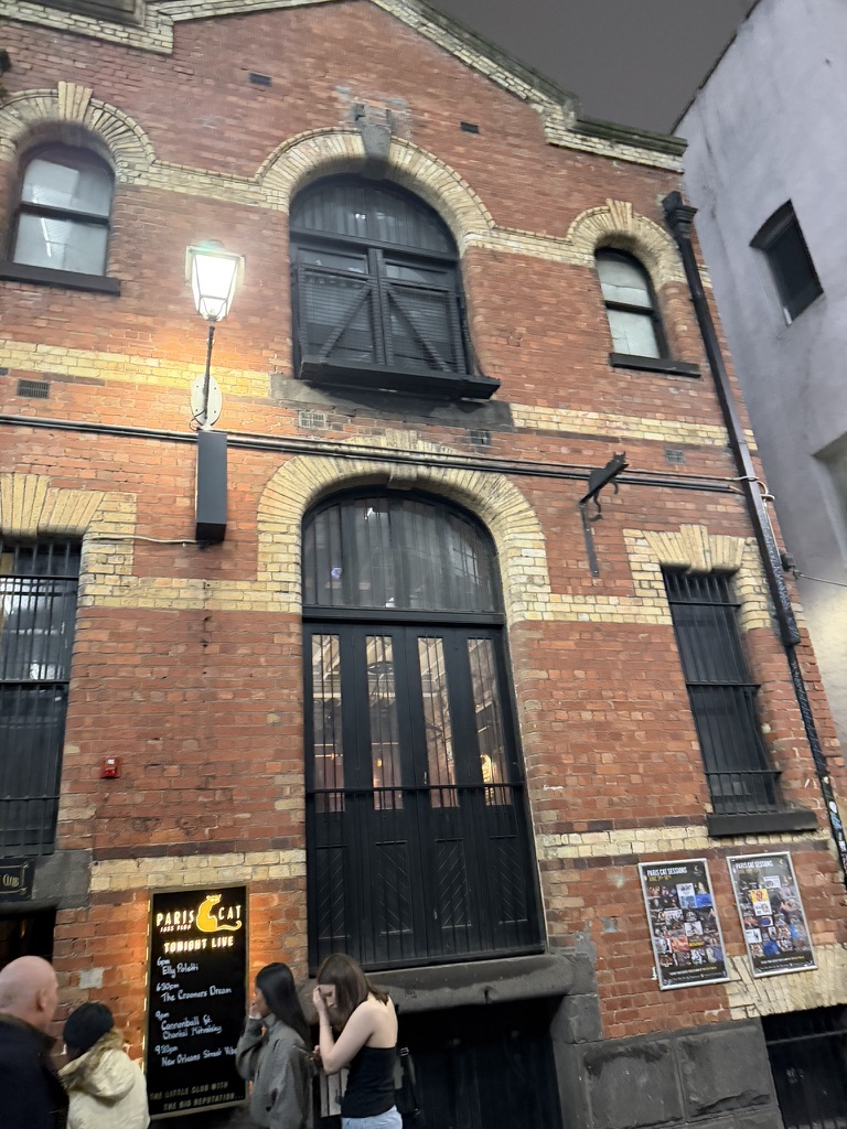 Paris Cat Jazz Club exterior on Goldie Place, Melbourne, with tonight's live music sign