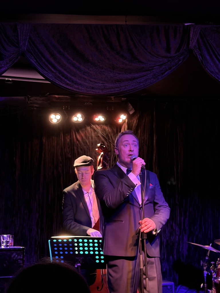 Wade Morgan singing on stage at Paris Cat Jazz Club, Melbourne, June 2026