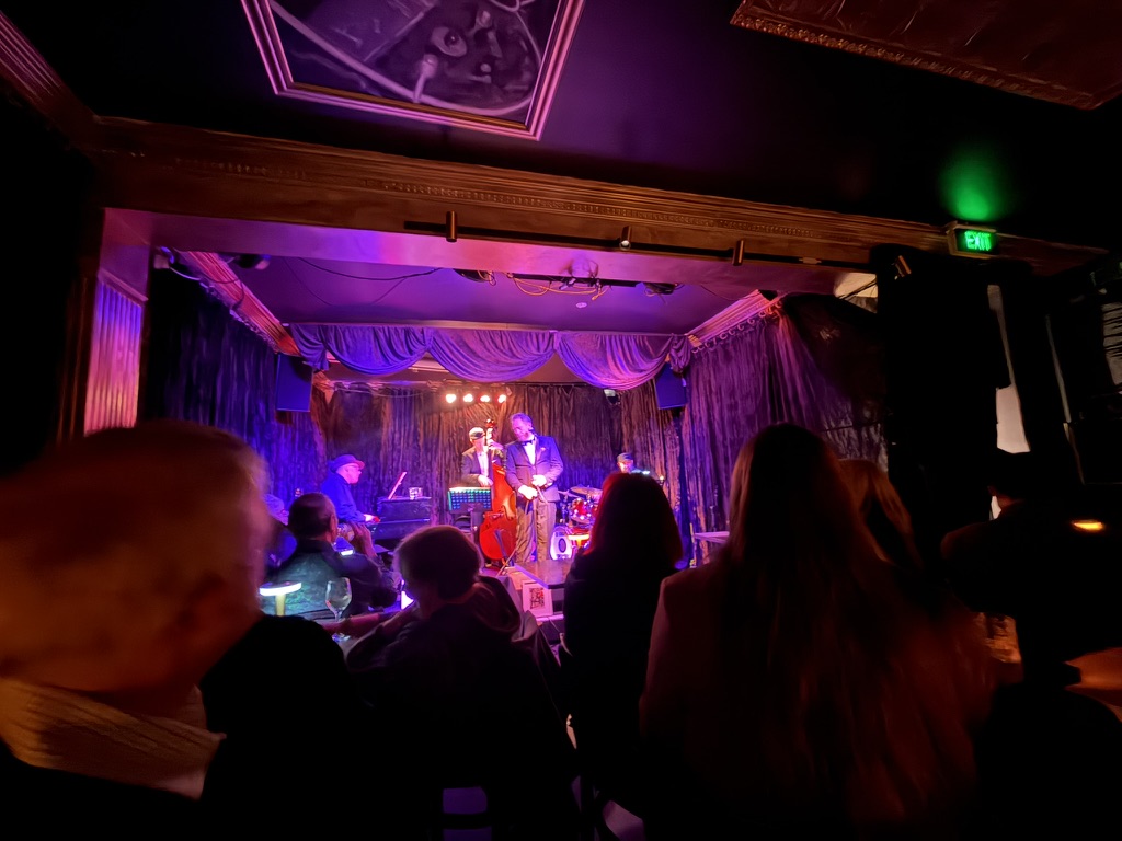 Wade Morgan and band on stage at Paris Cat Jazz Club with purple stage lighting